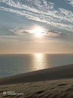 Sandwich Harbour : coucher de soleil, dunes et océan