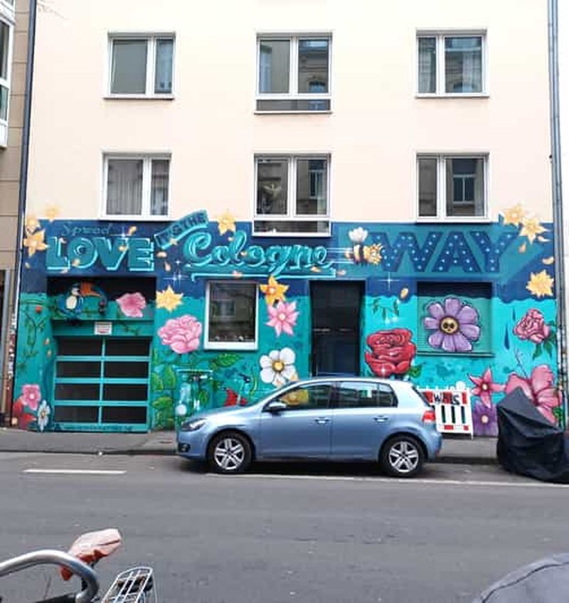 Cologne : visite à pied des arts de la rue dans le quartier belge